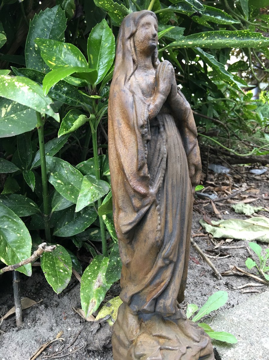 Stone statue of Mary, beautifully detailed, oxidized color