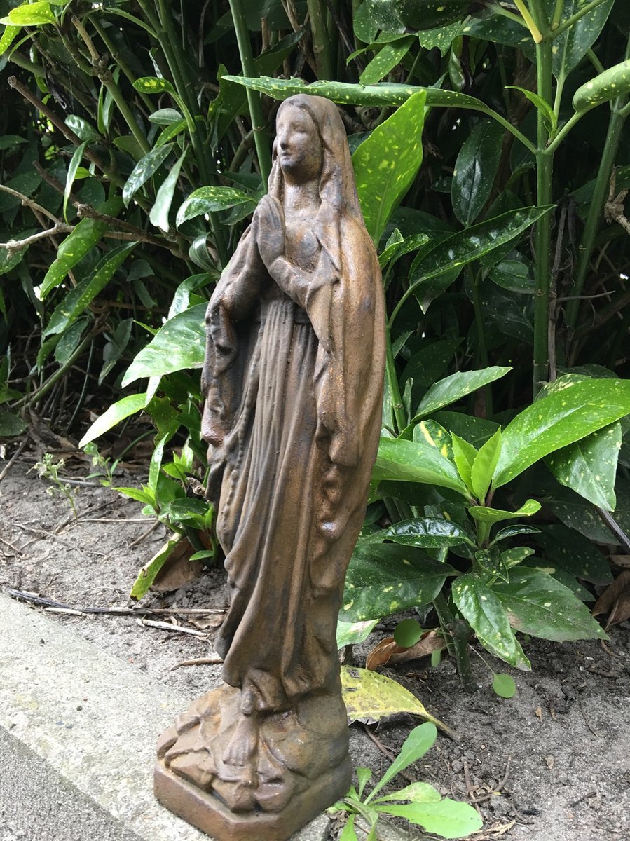 Stone statue of Mary, beautifully detailed, oxidized color