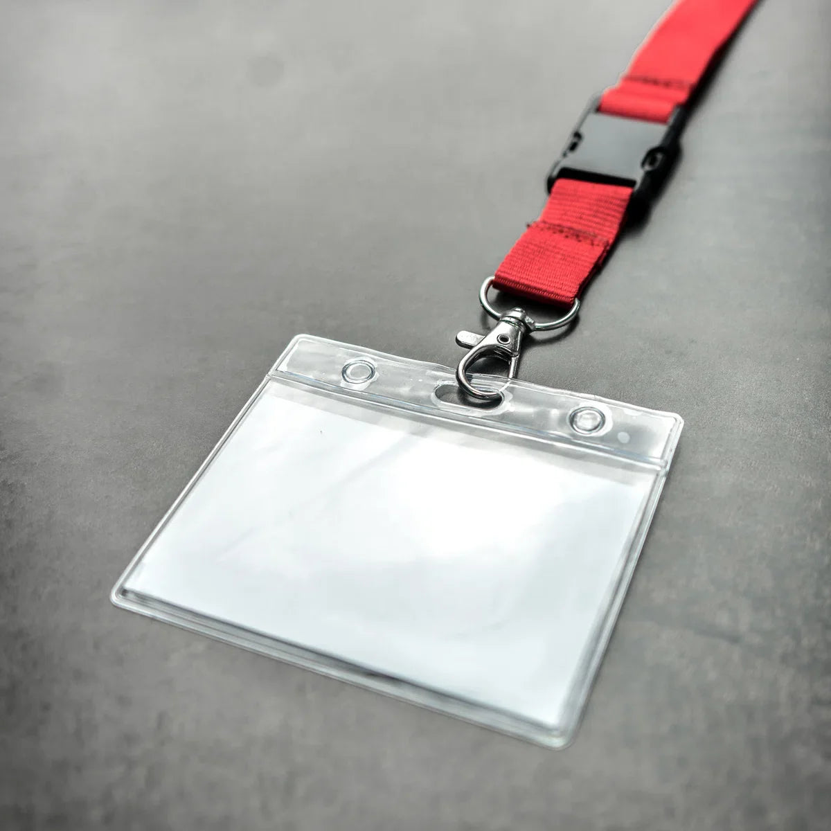 Red lanyard with badge/pass holder, per 50 pieces